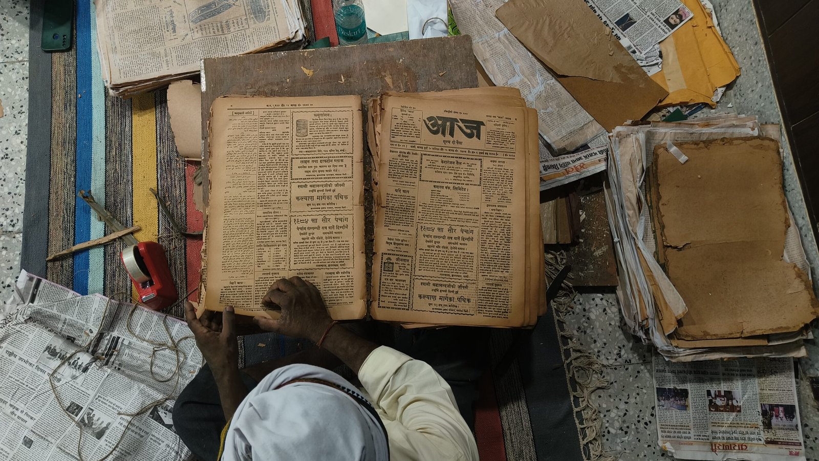 Book binders conserving old newspapers and magazines